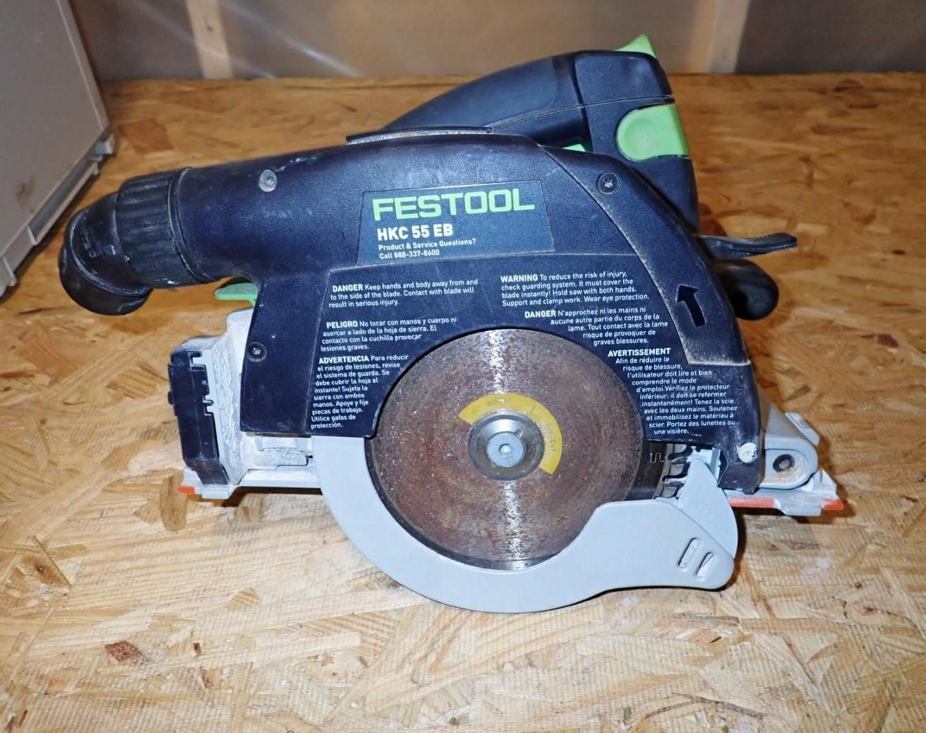 Festool circular saw resting on a plywood surface