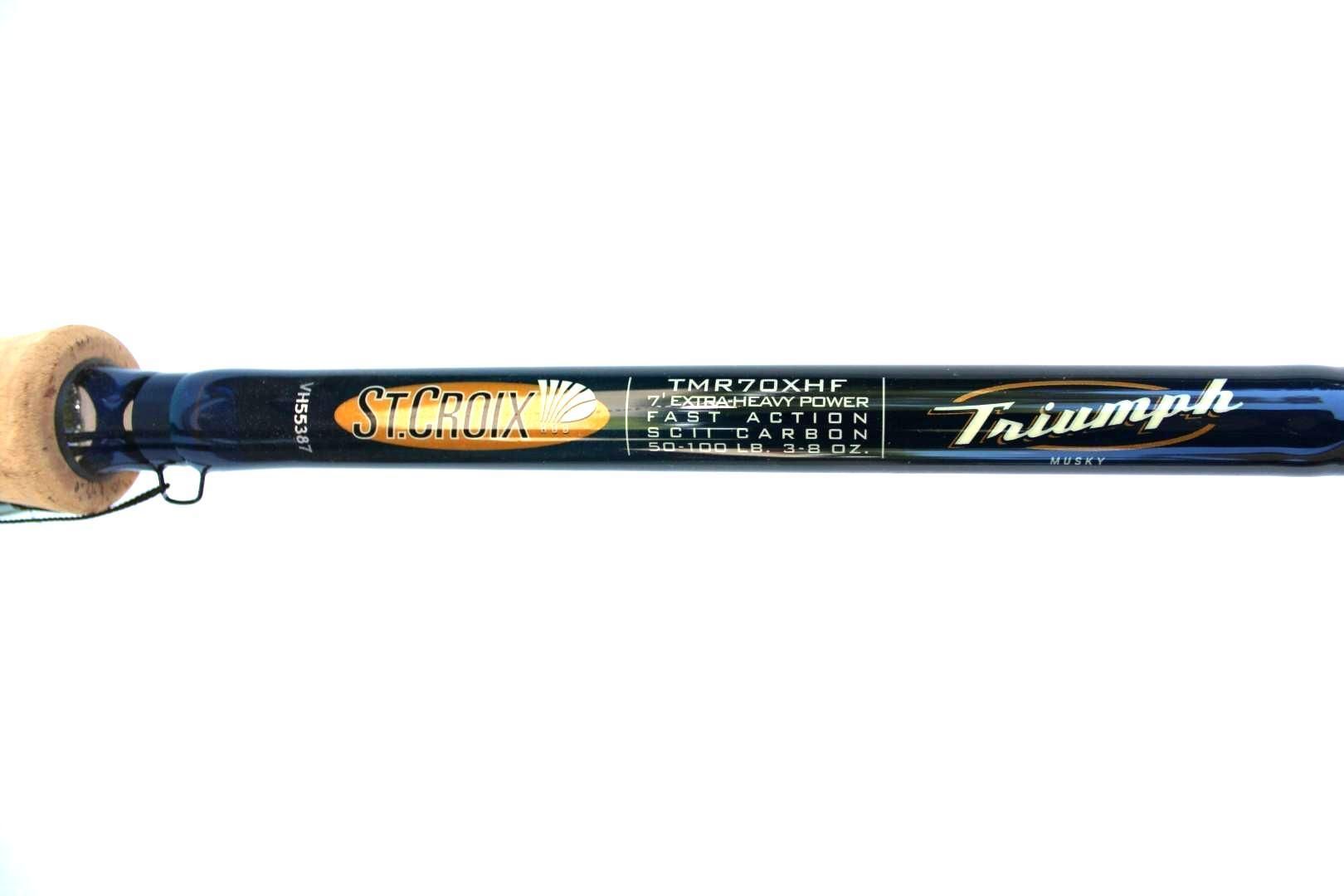 Close-up of a blue Triumph fishing rod with gold branding on a white background
