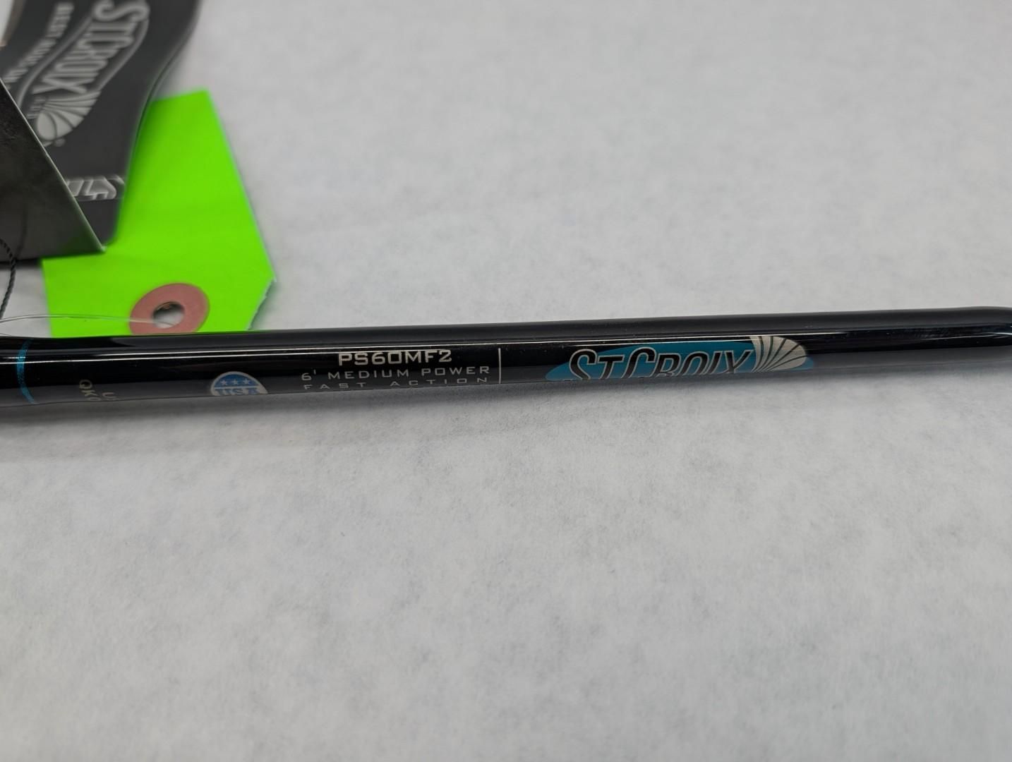 Black telescoping rod with blue-and-white text on a light background