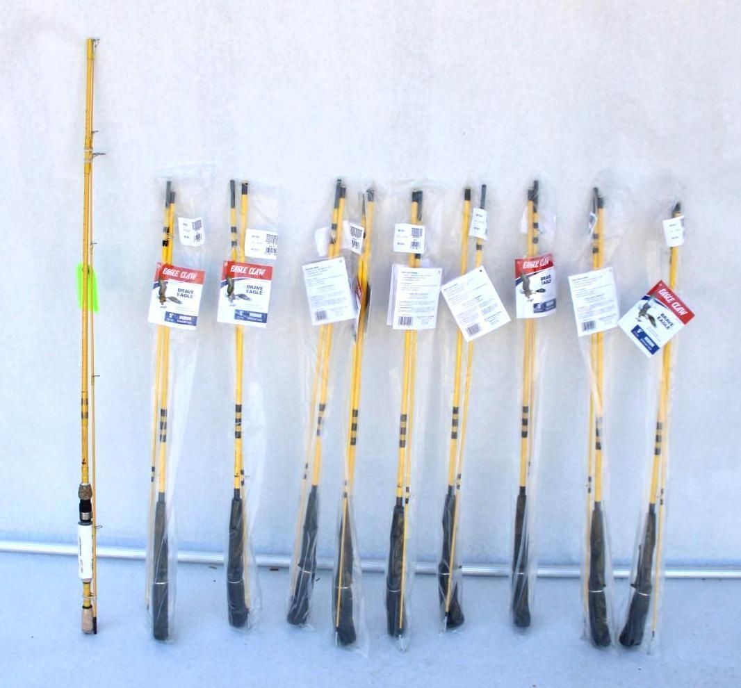 Several long-handled tools with black heads and hanging tags arranged against a white background