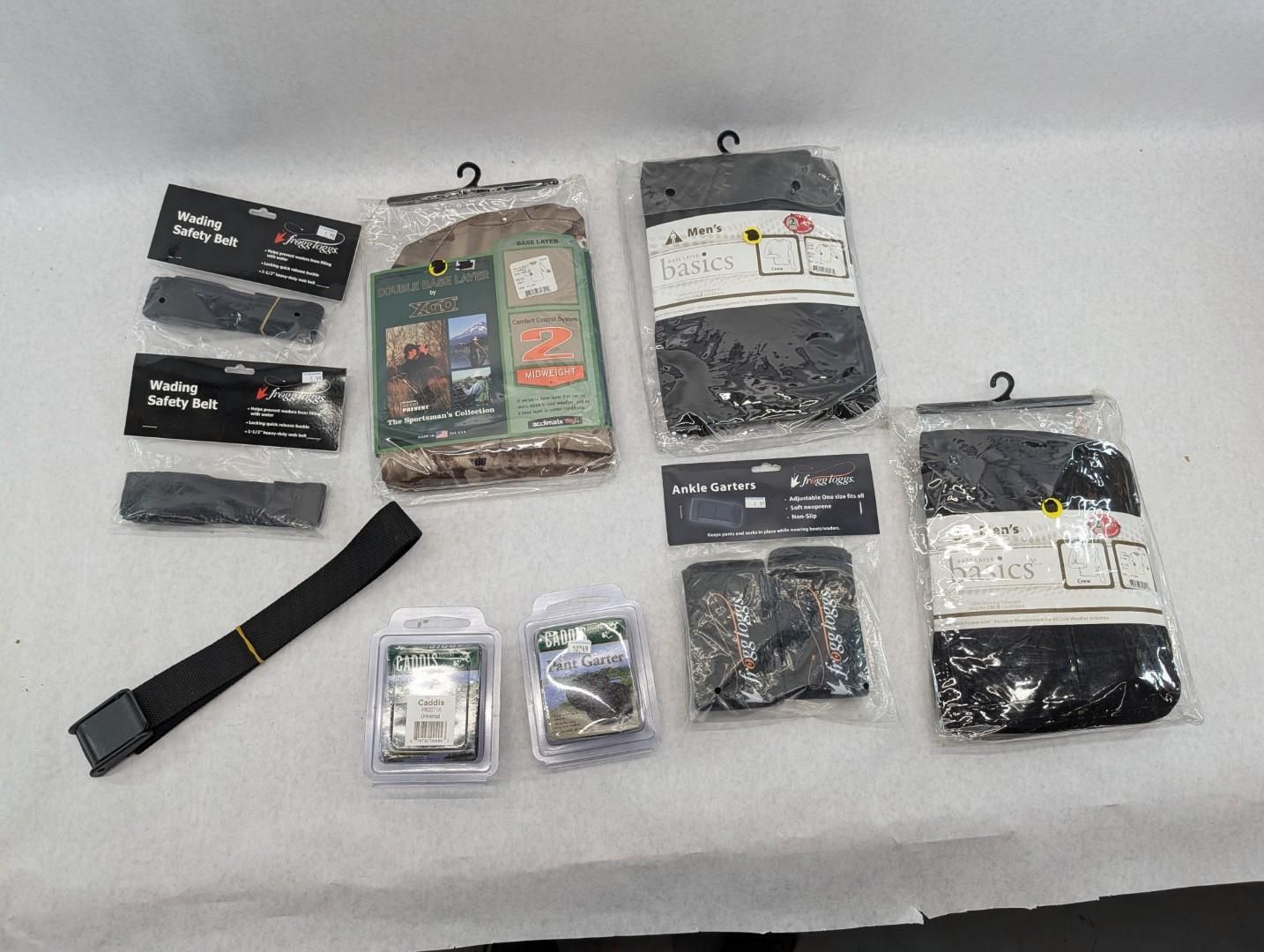 Assorted packaged watch bands and accessories laid out on a white surface.