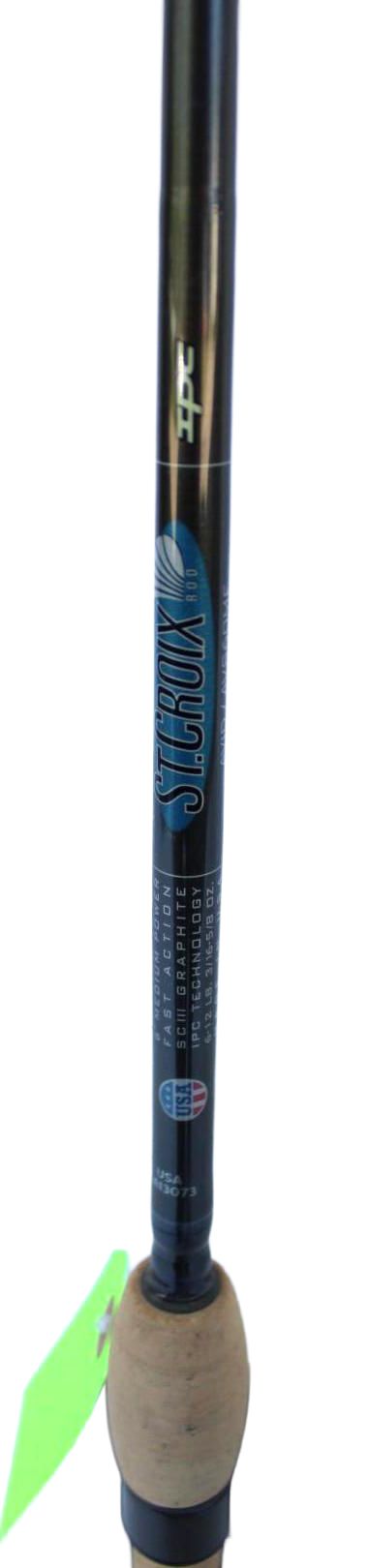 Close-up of a fishing rod with a blue grip and cover against a white background