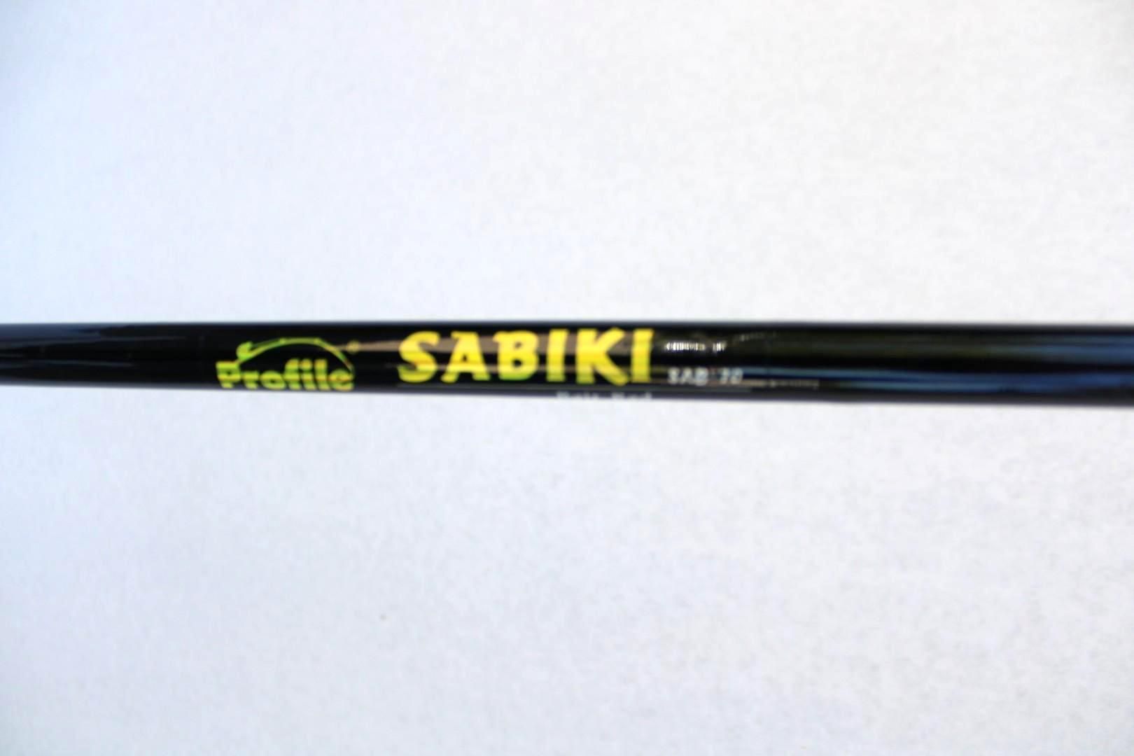 Black fishing rod labeled “SABIKI” on a white background