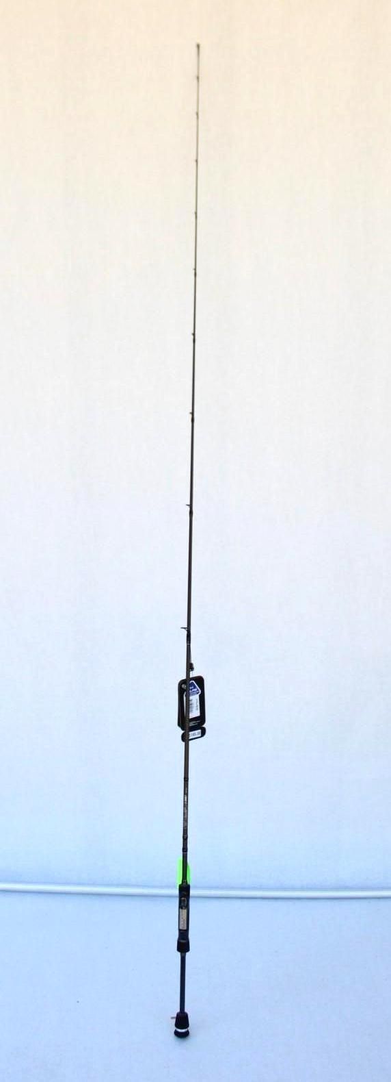 A fishing rod standing upright against a plain white wall with a blue baseboard.