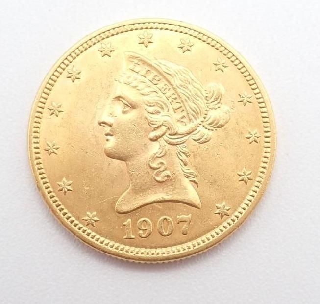 1907 gold coin with a profile portrait and stars around the rim