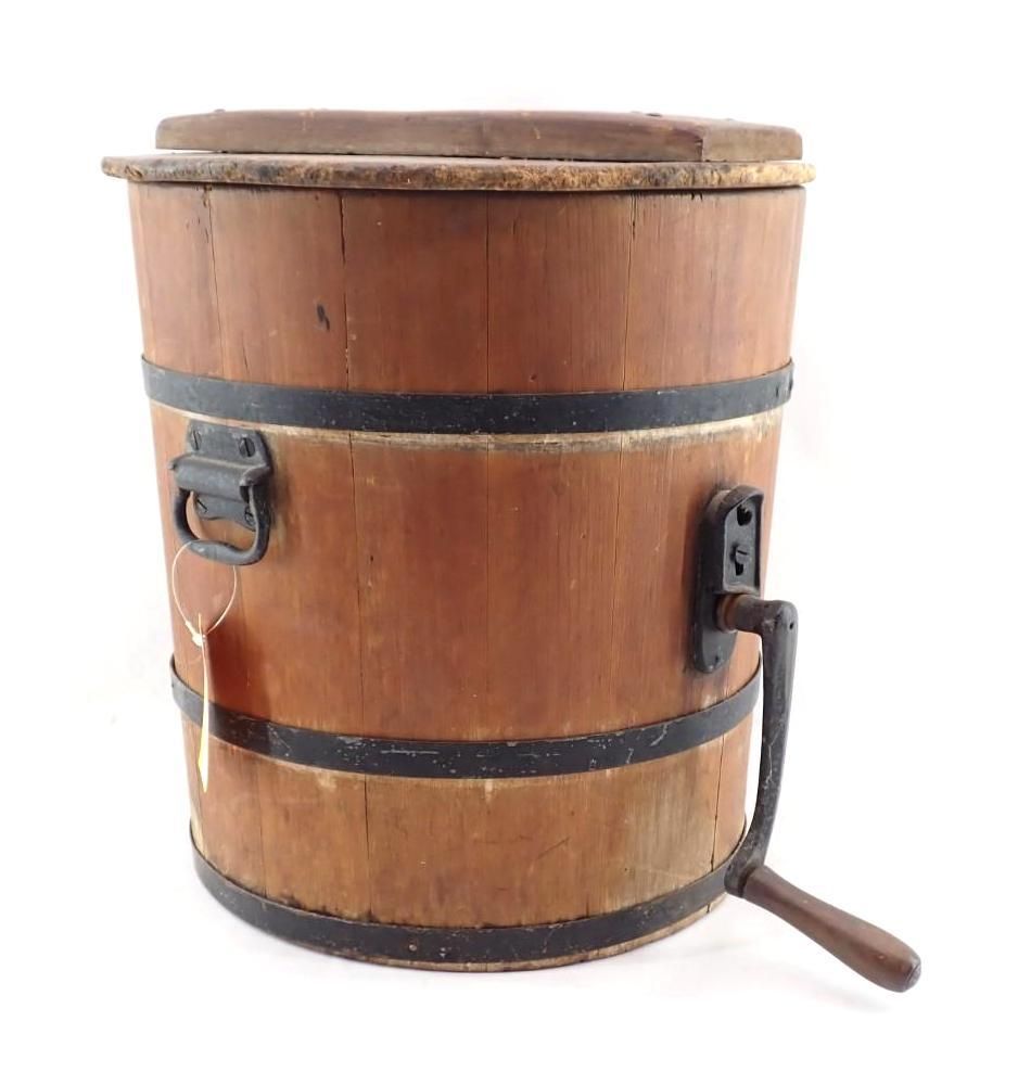 Wooden bucket with metal bands and a side handle on a white background