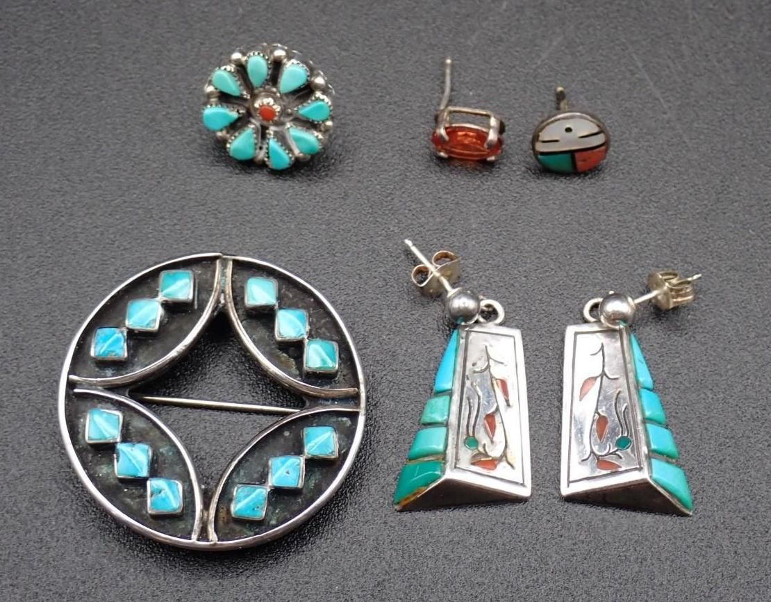 Assorted turquoise-and-silver Native-style jewelry: ring, studs, and dangling earrings on a gray background