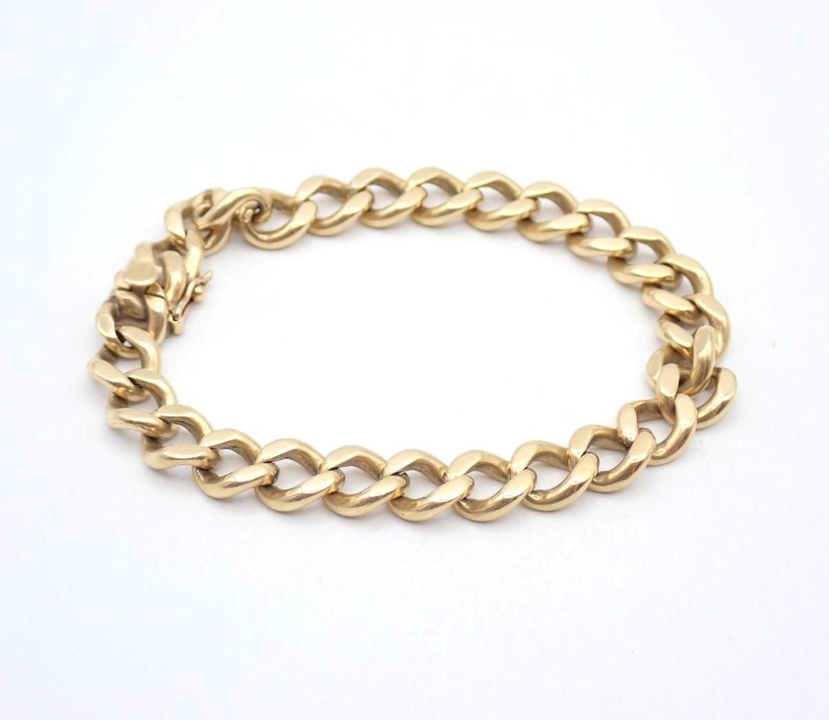 Gold chain bracelet on a white background