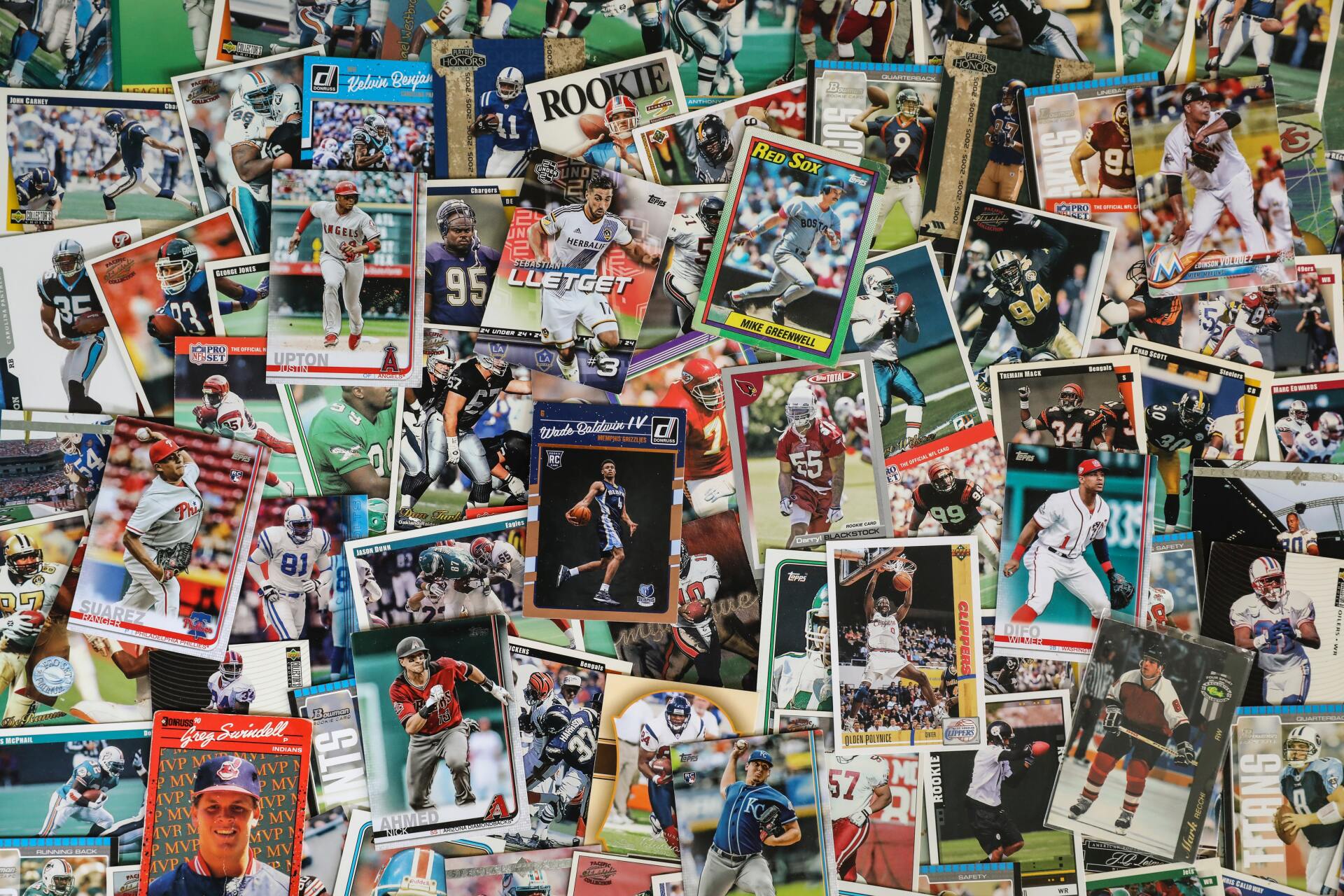 Collection of sports trading cards, mostly action shots of players in various uniforms.