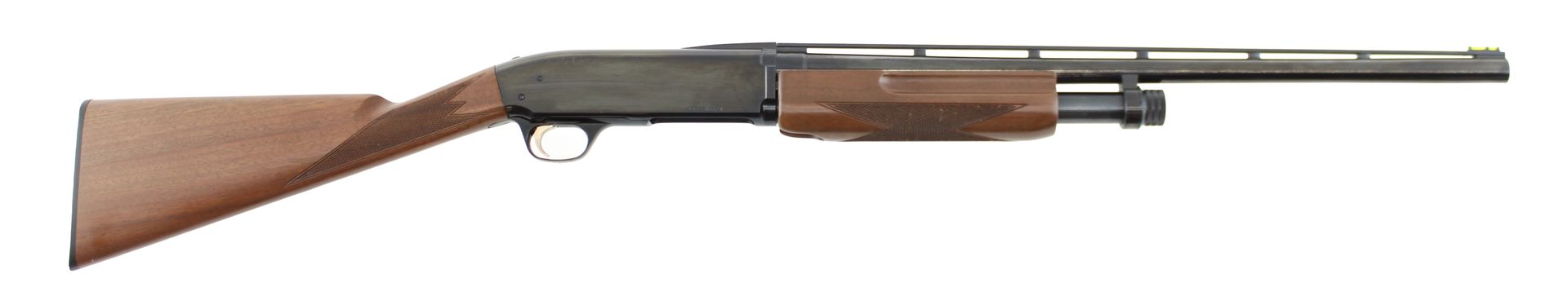 Side view of a wooden-stock shotgun with a long barrel on a white background