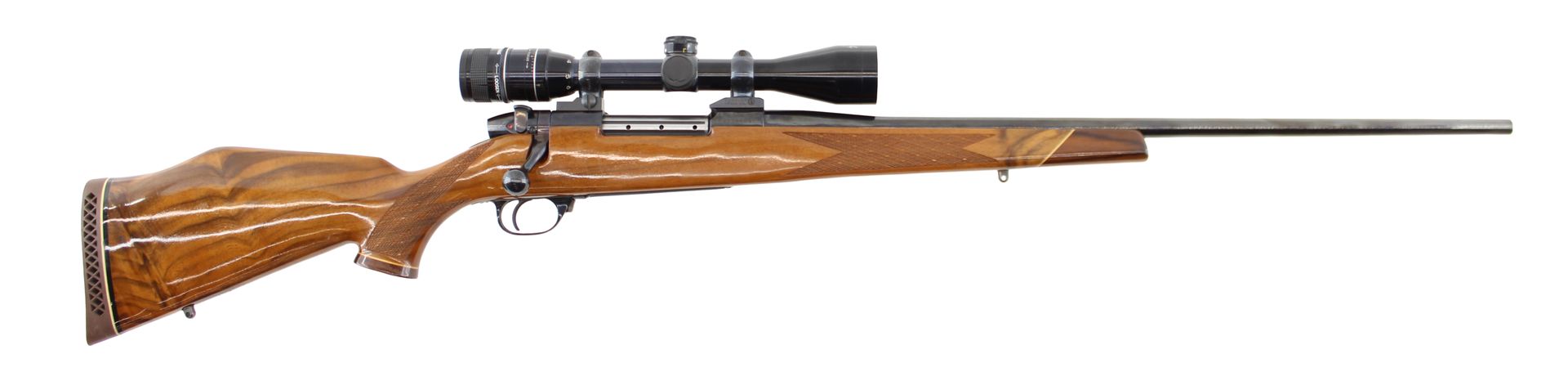 Bolt-action hunting rifle with scope, wooden stock, and long barrel on a white background