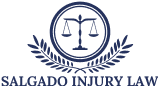 Salgado Injury Law logo with navy justice scales and laurel wreath above the firm name