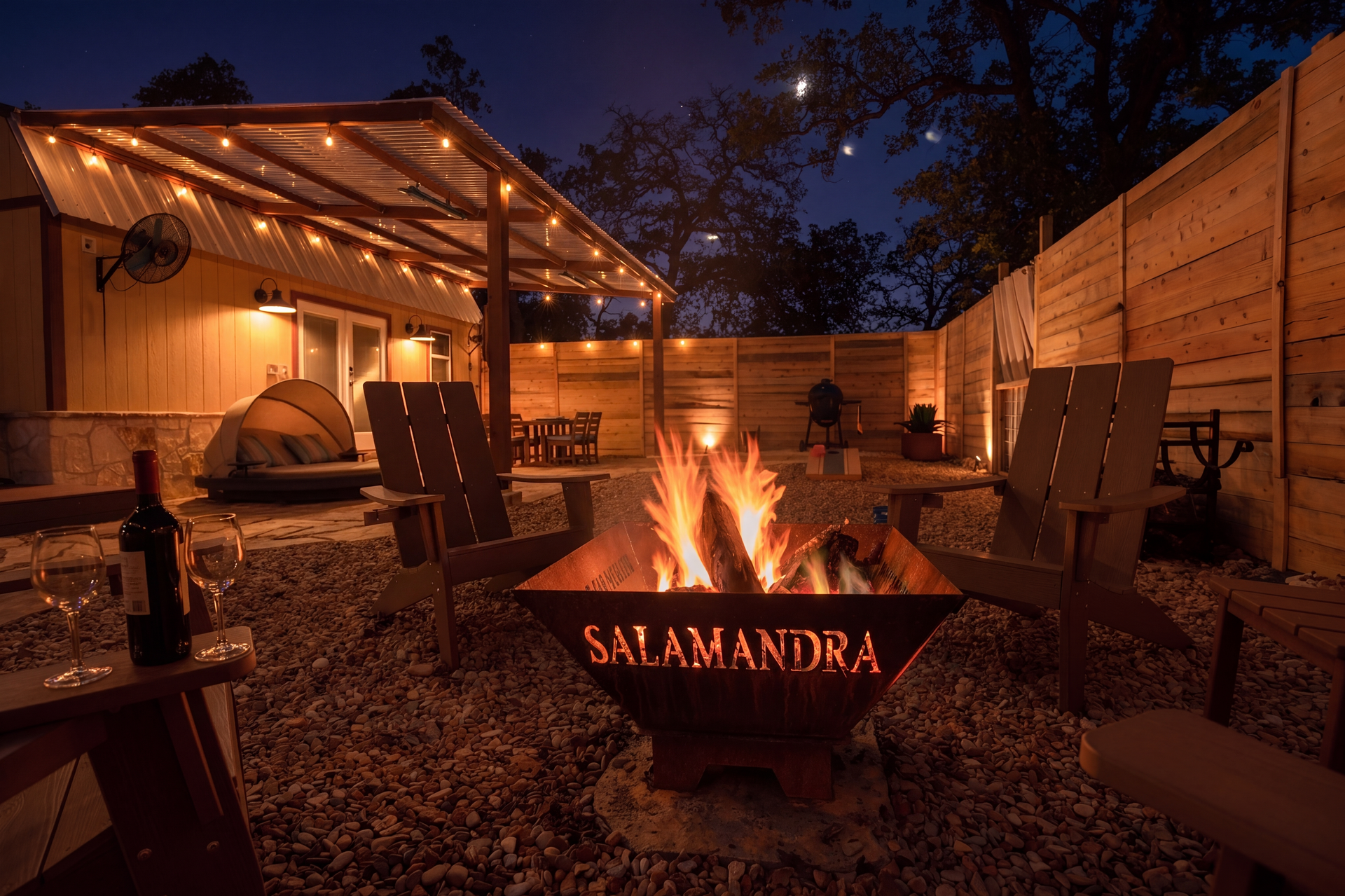 Salamandra private fire-pit yard illuminated beneath the night sky