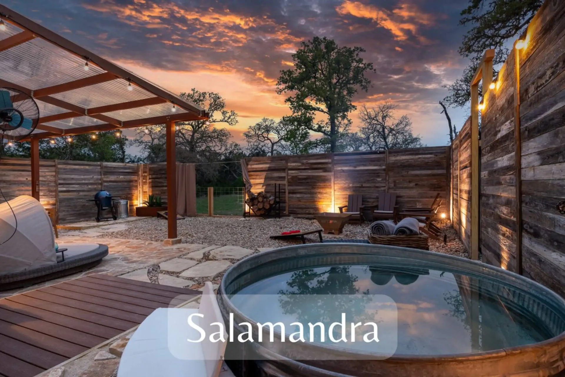 The private sauna and plunge yard glowing at dusk at Avandaro Ranch in Wimberley.