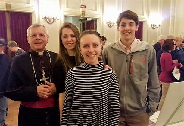image of students and Bishop at a theater