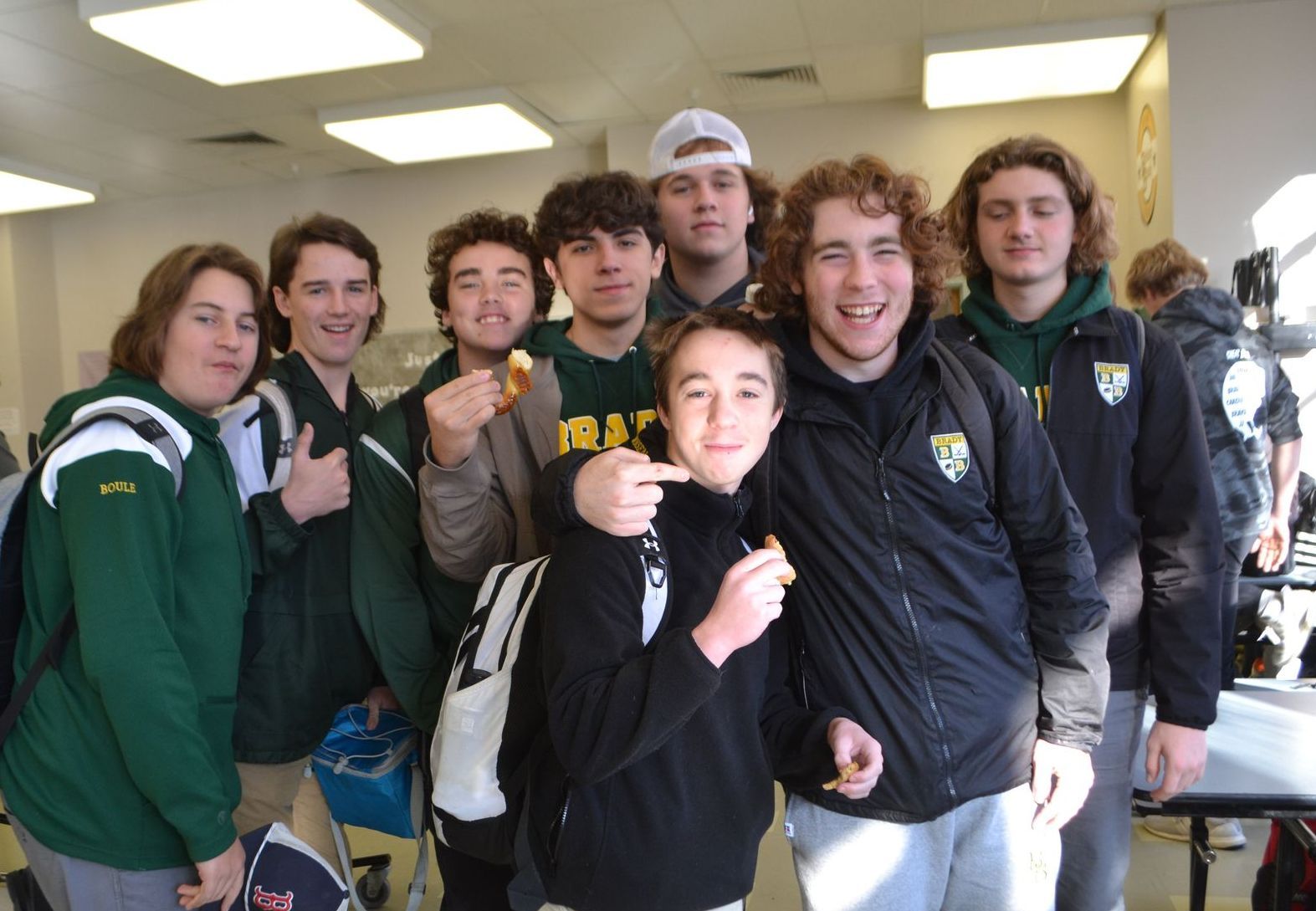 image if male students smiling in a classroom 