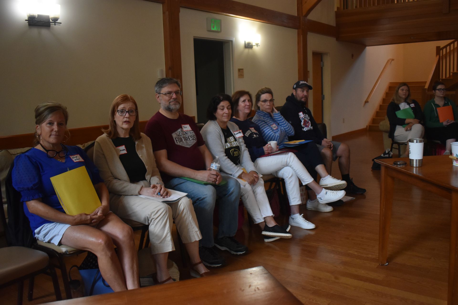 teachers at retreat house sitting on a bench 