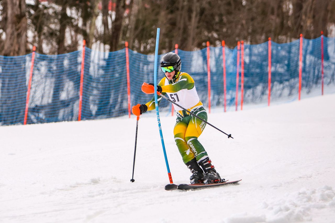 skier outside on a trail competing in a race