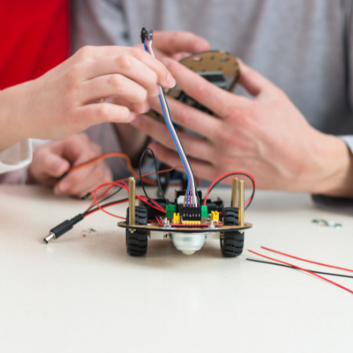 hands working on robot