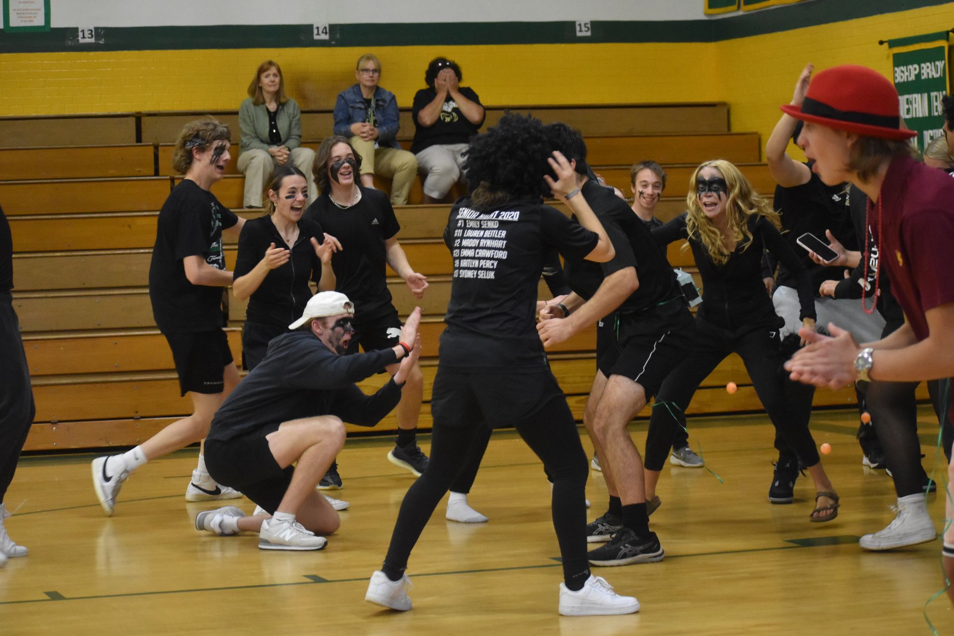 group of students playing a game in the high school gym.