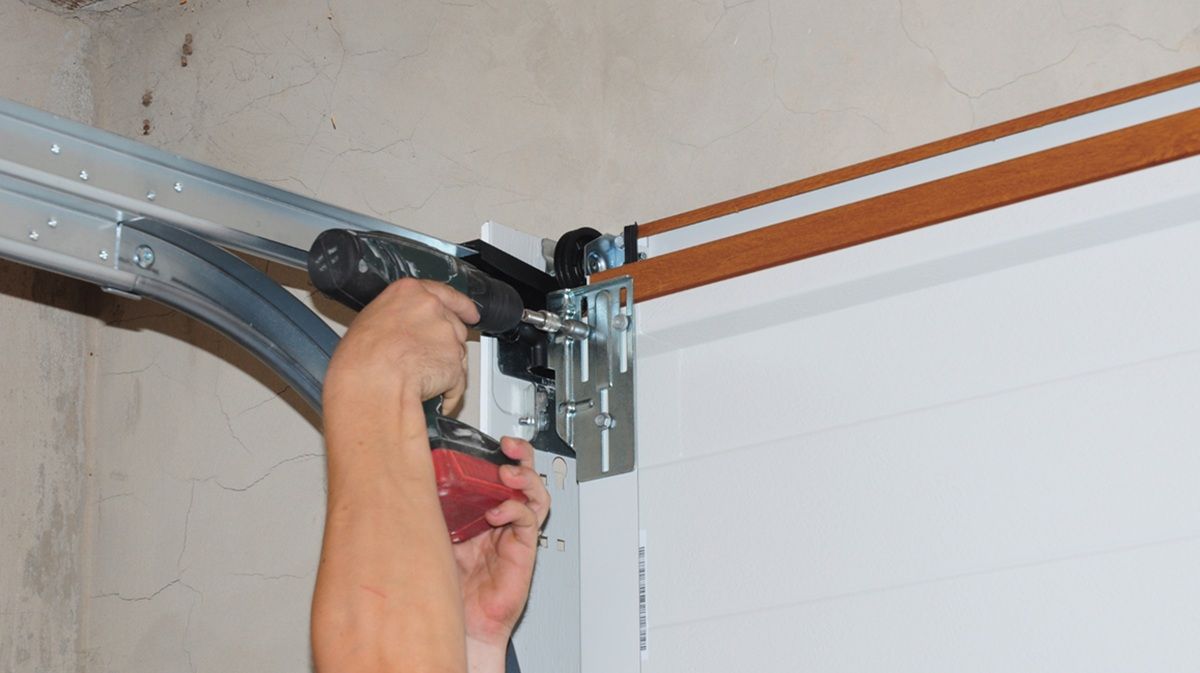 Experienced technician working on a residential garage door in Tulare
