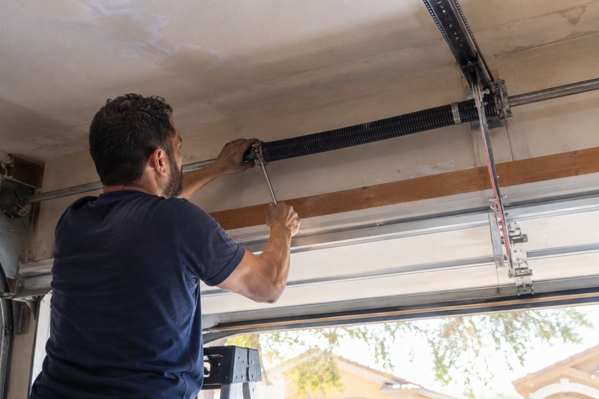Garage door spring repair project at a residential property in Tulare