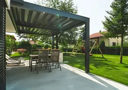 Inviting & Textured: Broom-Finished Concrete Patio Creates a Backyard Oasis in Maori Hill.