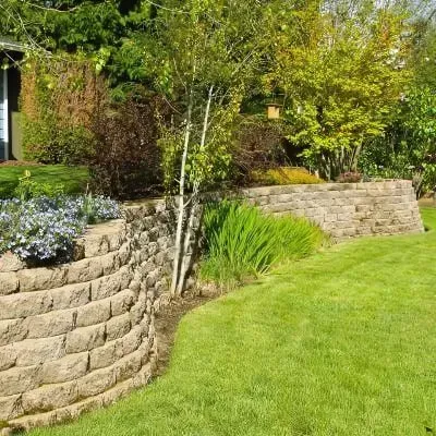 Well-constructed concrete block retaining wall, demonstrating quality craftsmanship in Musselburgh, Dunedin.