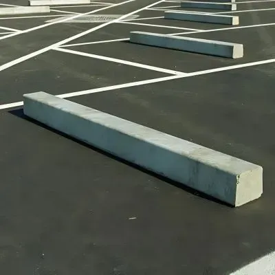 Expertly installed concrete car park stops in a Port Chalmers parking area.