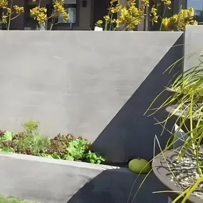 Freshly poured concrete retaining wall enhances a new garden landscape in Andersons Bay, Dunedin.