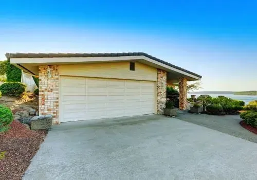 Newly poured concrete driveway overlooking Long Beach in Dunedin.