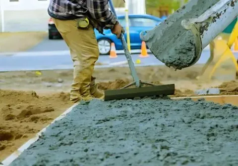 Dunners Concrete placers pouring and levelling a new driveway near Portsmouth Drive, Dunedin.
