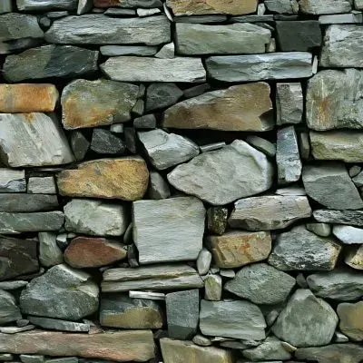 A beautifully crafted natural stone wall adds a touch of elegance to a property in Opoho.