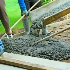Dunners Concrete contractors pouring concrete for a new driveway in Dunedin.