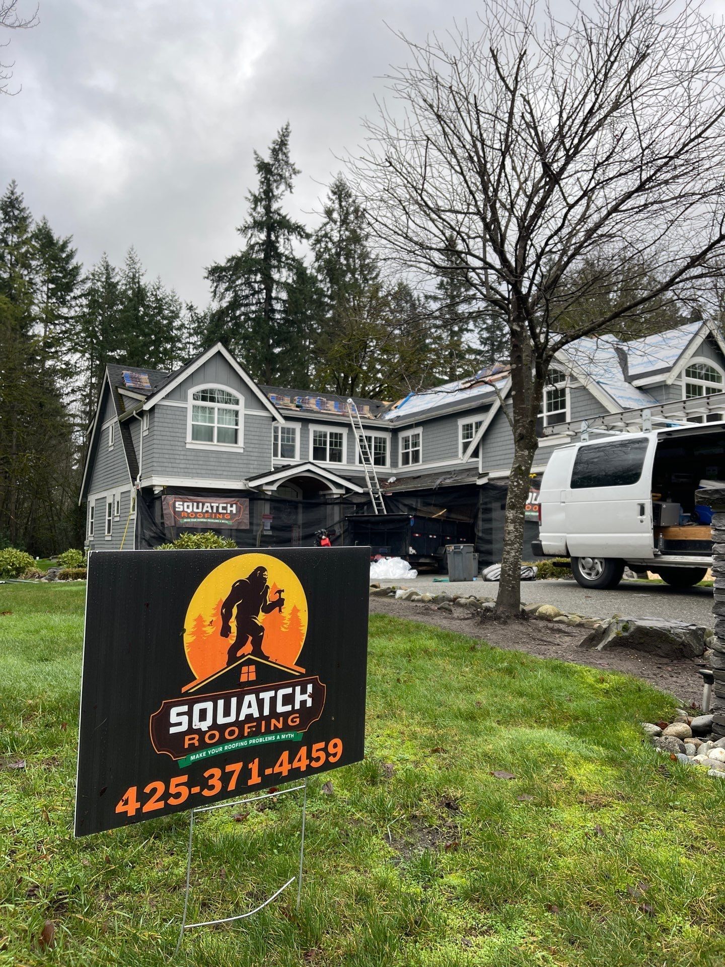 Roofers replacing house with new roof.