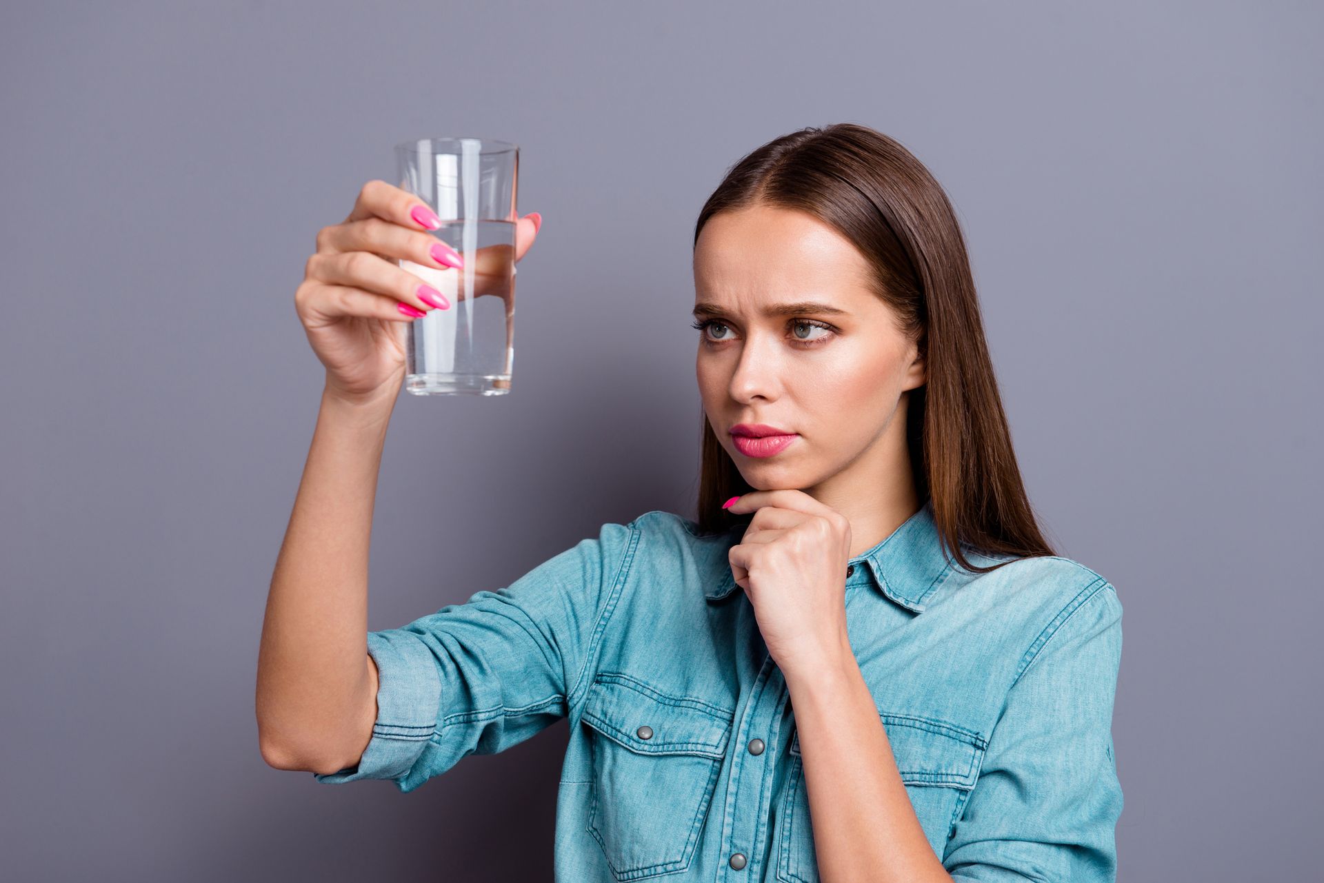 Woman Checking The Glass Of Water — McAllen, TX — Clear Choice H2O