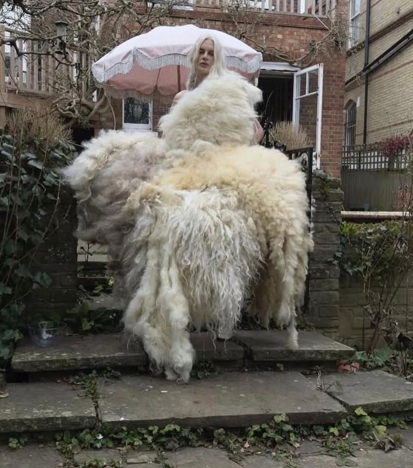 Model wearing a one-of-a-kind dress by Harry Potefract made from felted fleece rugs handcrafted by Deborah Griffin.