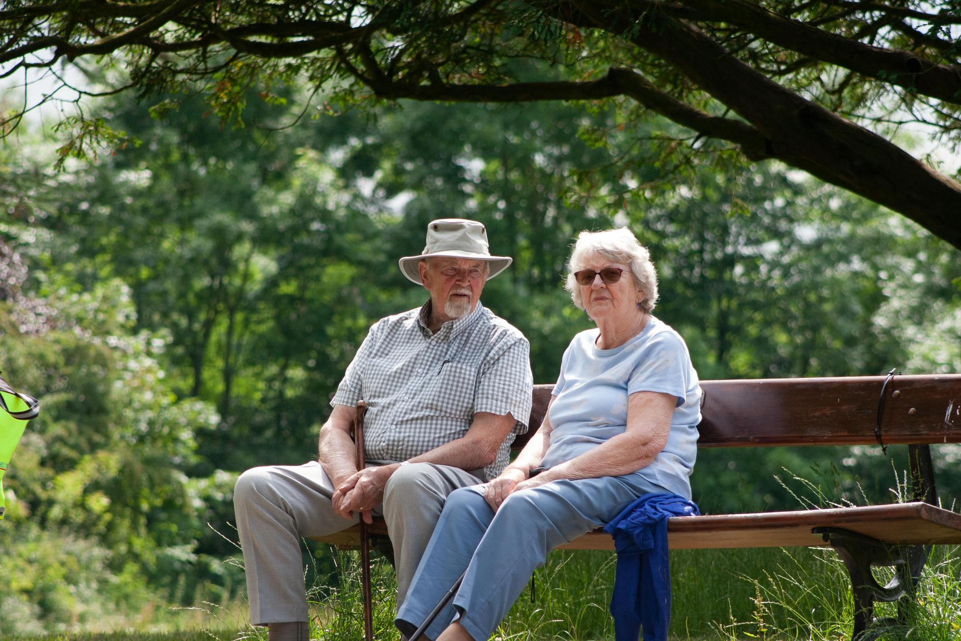 Elderly Couple Sitting on Park Bench