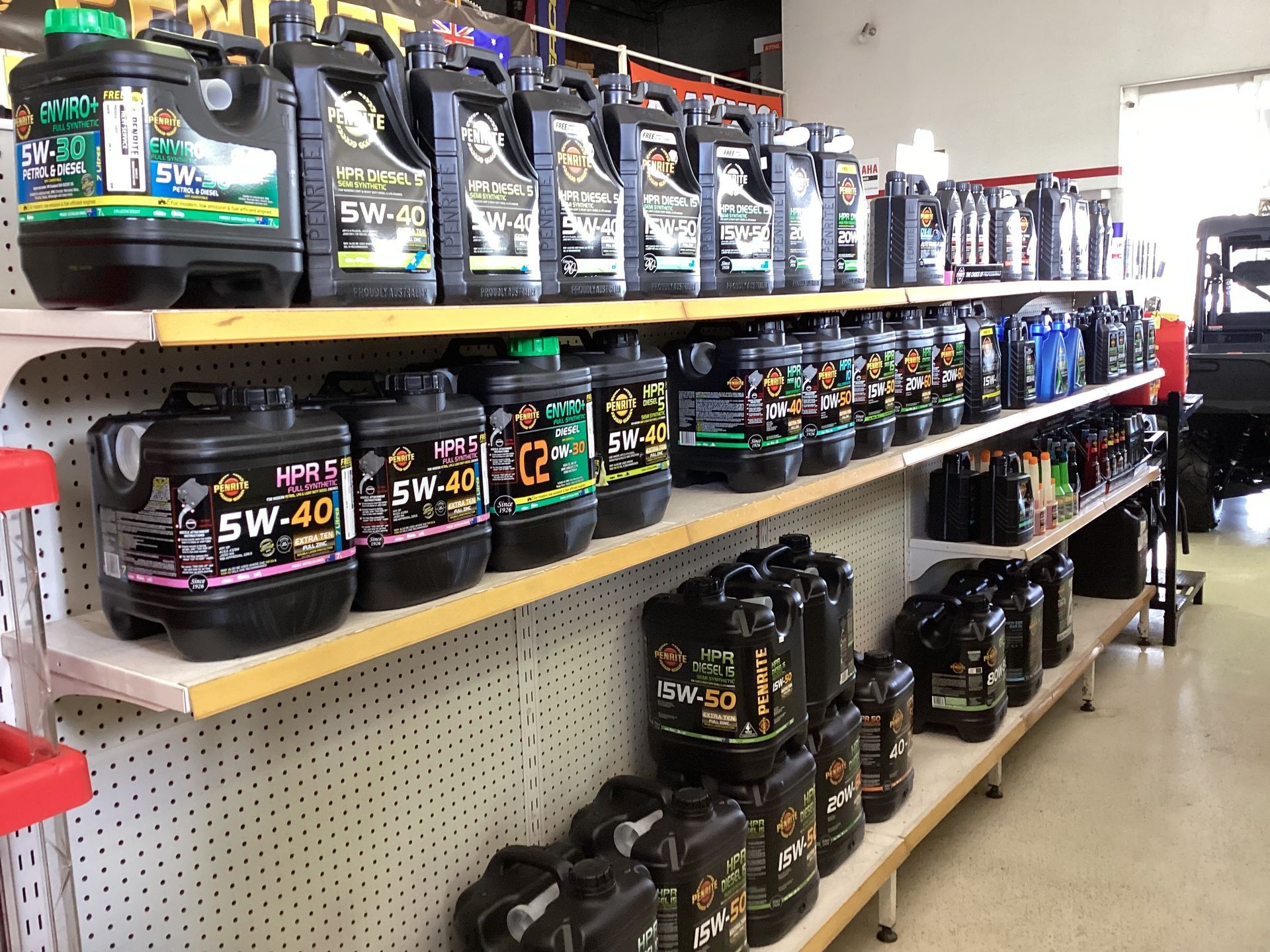 A Close Up Of Shelves Full of Different Engine Oils — Coastal Farm & Motorcycles In Innisfail, QLD