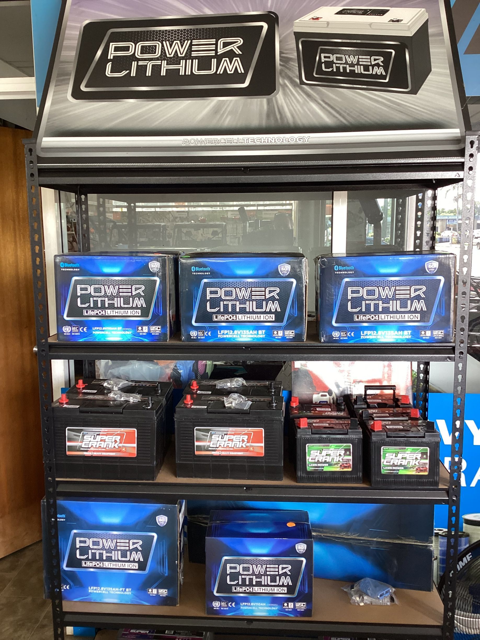 A Row Of Batteries Sitting On Top Of A Shelf In A Store — Coastal Farm & Motorcycles In Innisfail, QLD