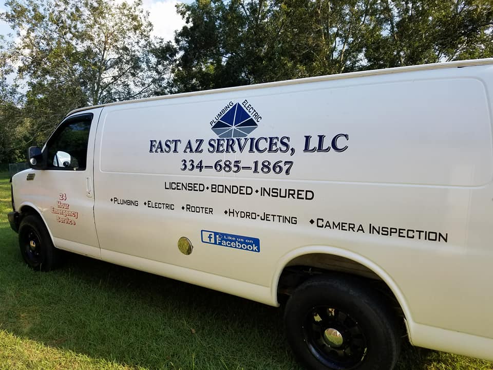 White service van with “Fast AZ Services, LLC” logo and phone number parked on grass outdoors