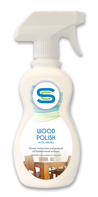 A bottle of wood polish with a picture of a table and chairs on it.