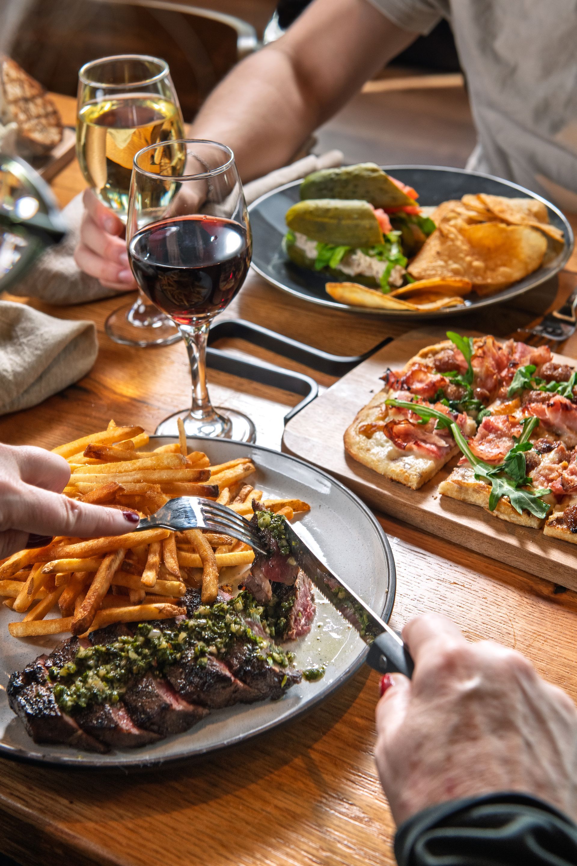 food offerings from the KITCHEN Table including fries and flatbread pizza