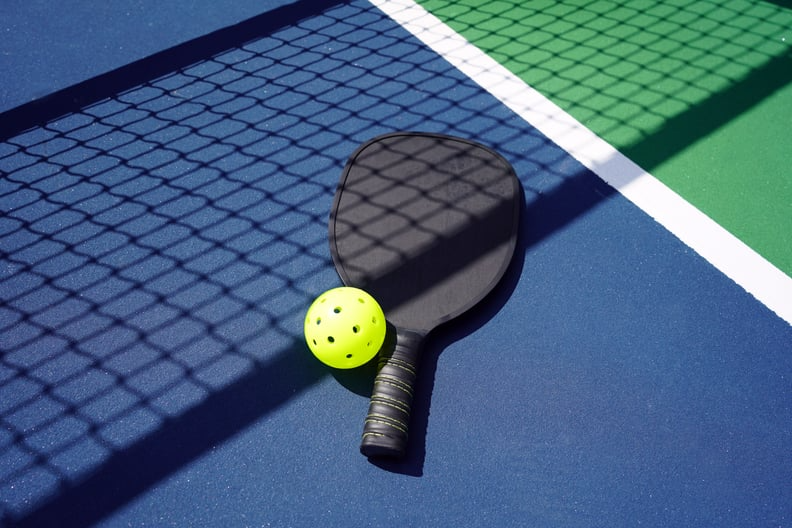 a pickleball paddle and ball