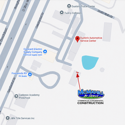 Map with a red pin pointing to a construction location near a blue pond and nearby roads.
