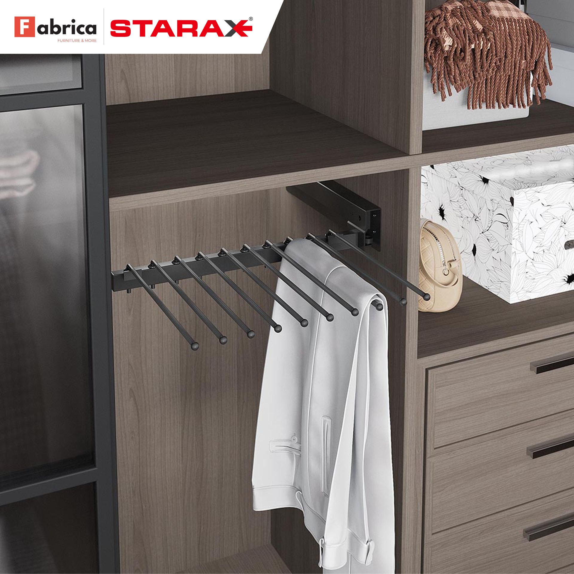 A fabrica starax closet with pants hanging on a rack