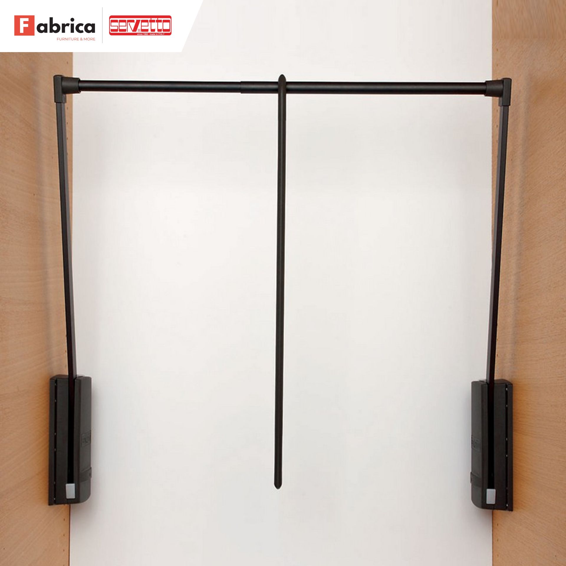 A black fabrica clothes rack is mounted to a wall