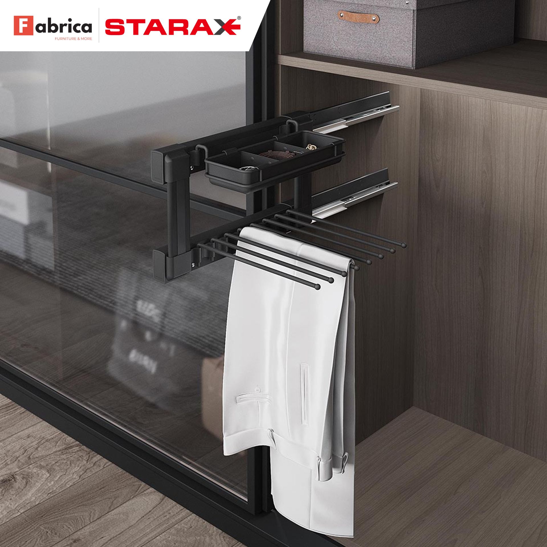 A pair of white pants is hanging on a rack in a closet.