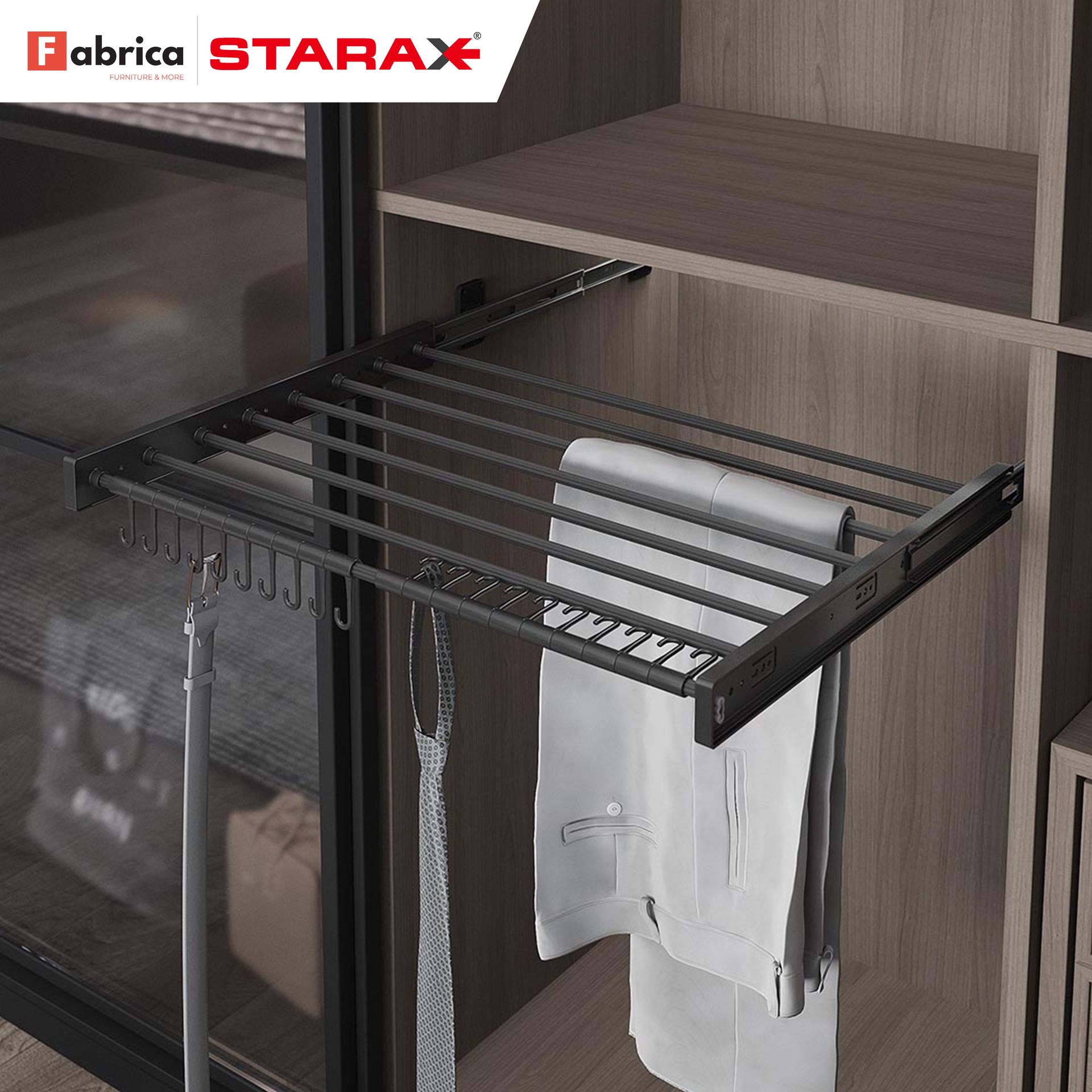 A clothes rack in a closet with fabrica starax written on the top