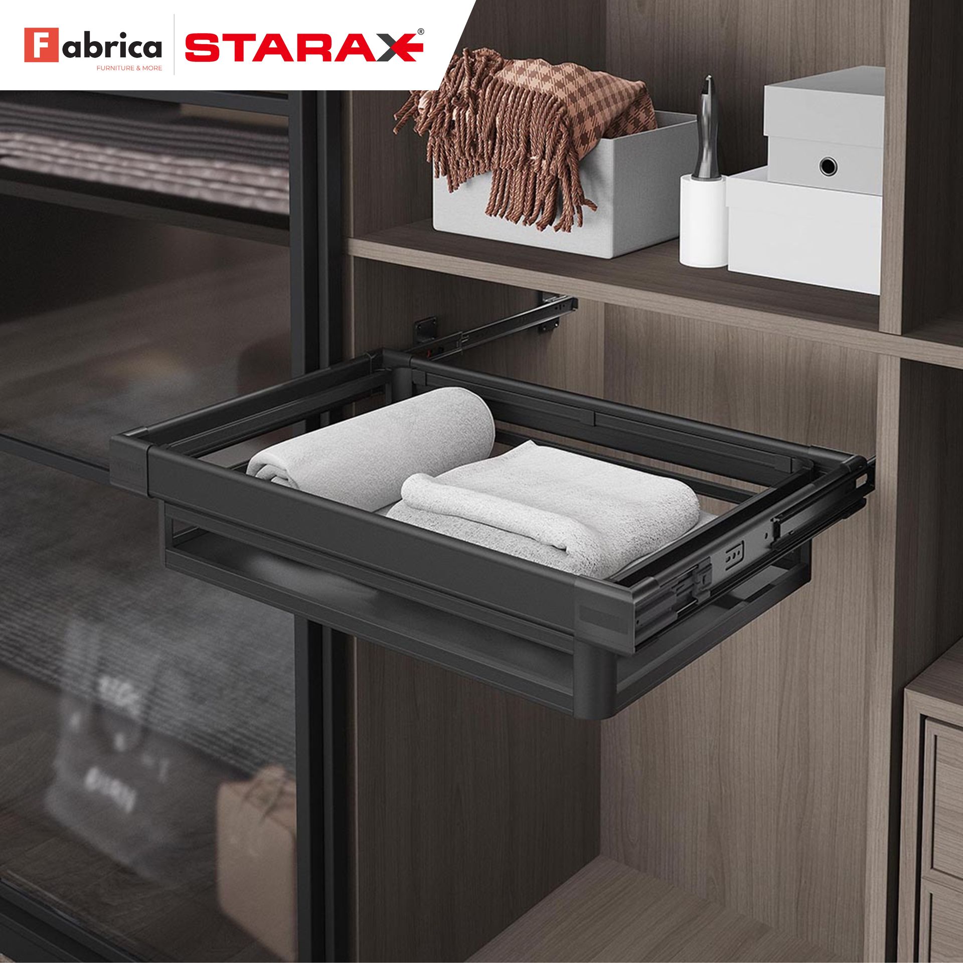 A tray with towels in it is in a closet.